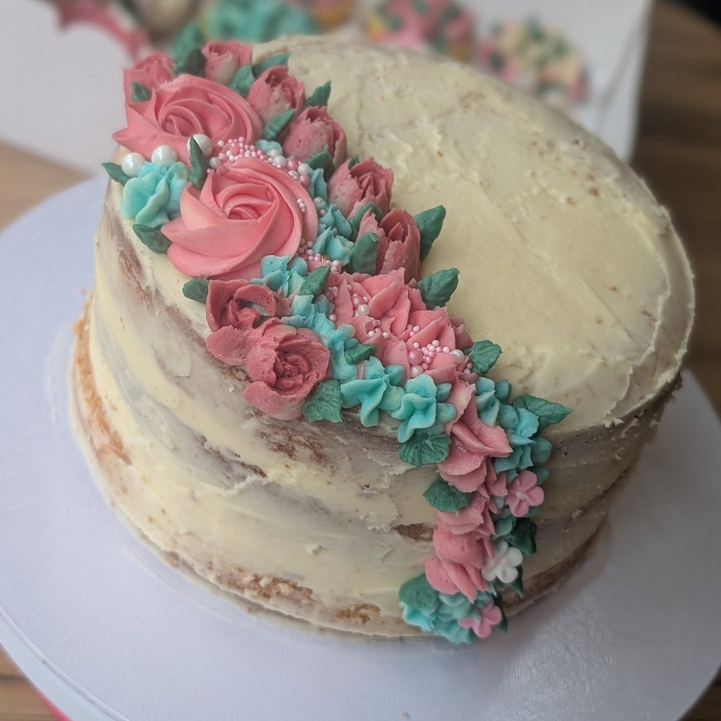 Semi-naked cake with floral topping